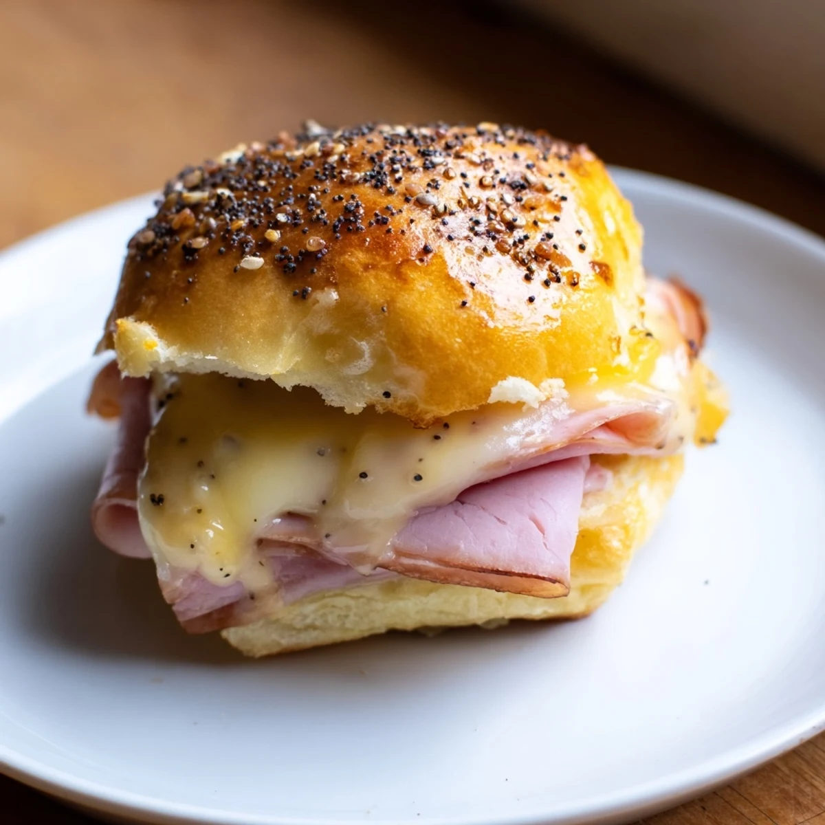 Melting Swiss cheese and savory ham combine beautifully in these easy, crowd-pleasing Baked Ham and Cheese Party Sliders.