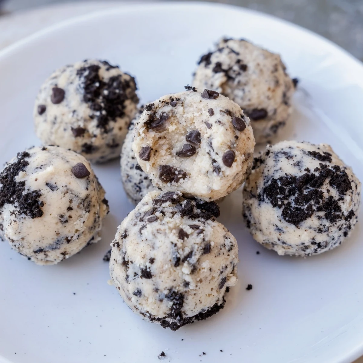 Cream Cheese Oreo Protein Balls displayed: creamy, speckled bites ready for a delicious, high-protein snack.