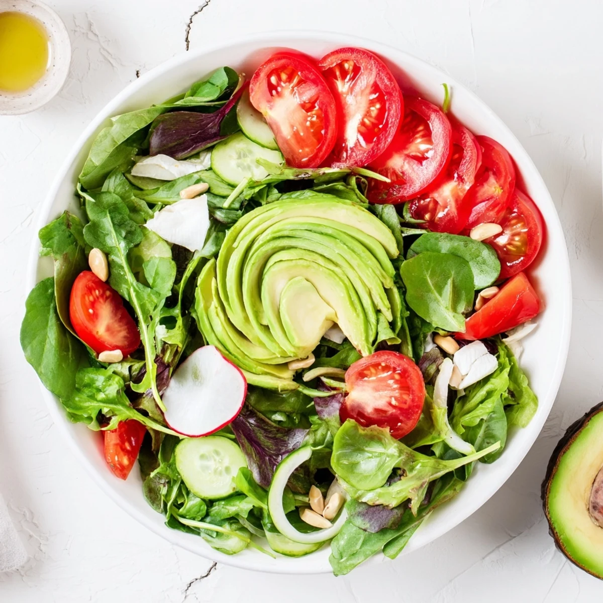 Vibrant Golden Ratio Salad with cherry tomatoes, avocado, and feta, ready to serve and enjoy.