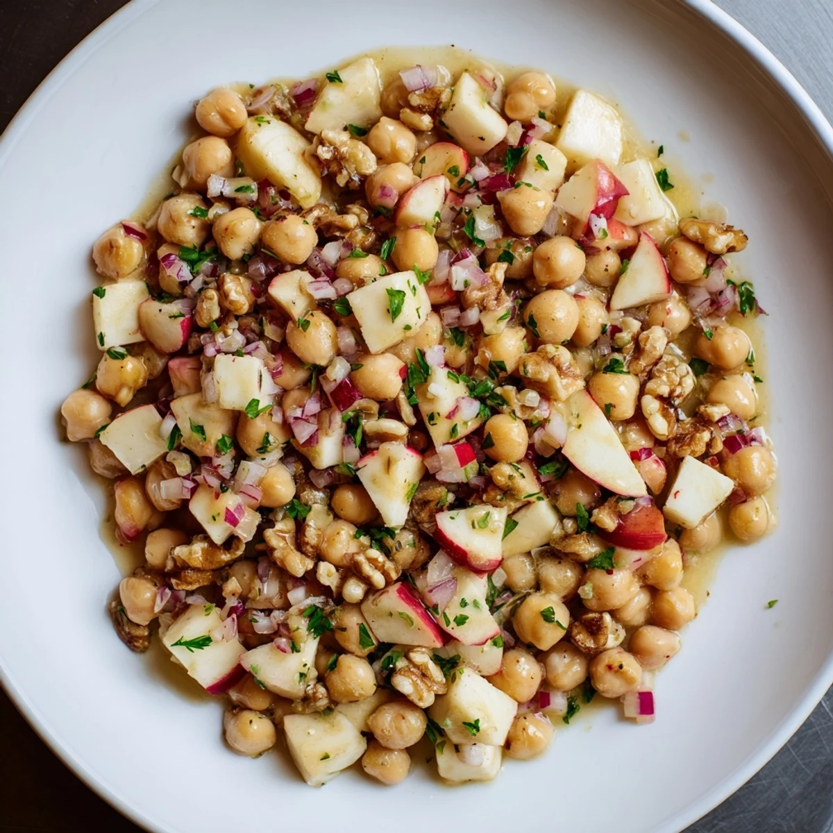 Tossed Fall Harvest Apple and Chickpea Salad, with walnuts and a delicious honey-mustard dressing.