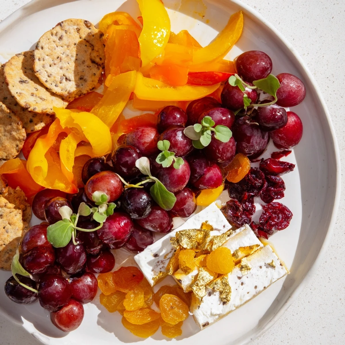Beautiful Crimson & Gold Gala appetizer platter: cherries, cheese, and roasted golden peppers delight.