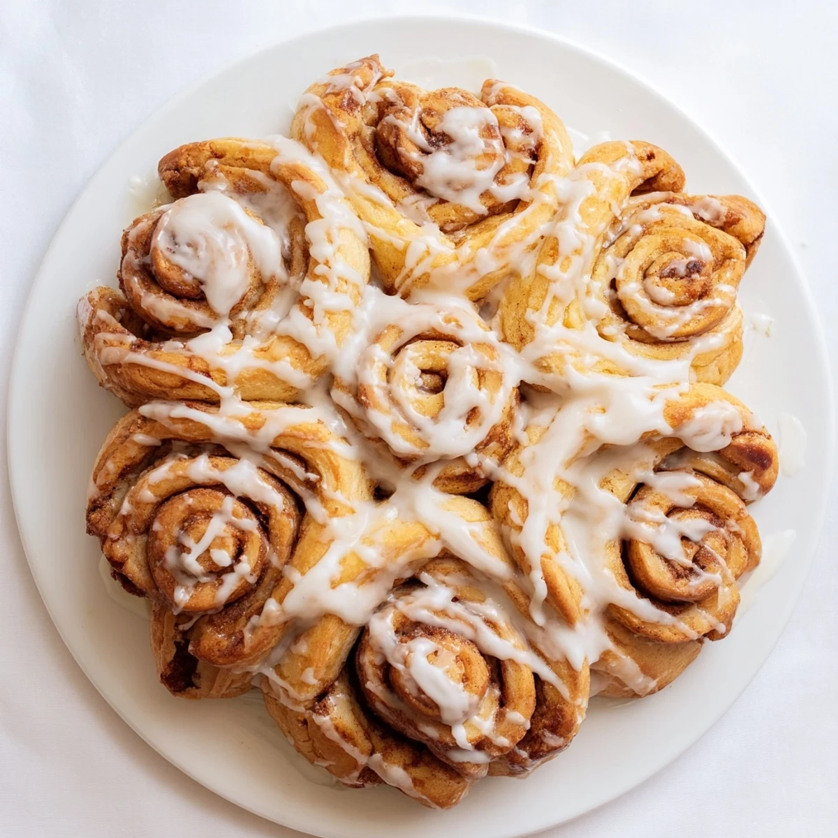 Imagine a beautifully shaped Cinnamon Roll Pull-Apart Snowflake with a fluffy, tender texture, perfect for sharing.