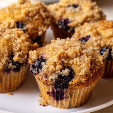 Warm blueberry muffins with buttery streusel topping are the perfect morning treat.  