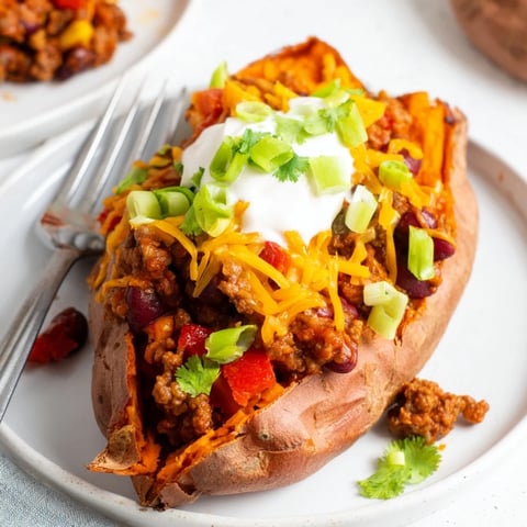 Steaming hot Baked Sweet Potato Stuffed with Chili, boasting vibrant colors and a delightful aroma.