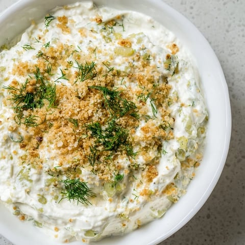 Creamy Fried Pickle Dip, ready to serve with crispy chips, is brimming with tangy pickle flavor.