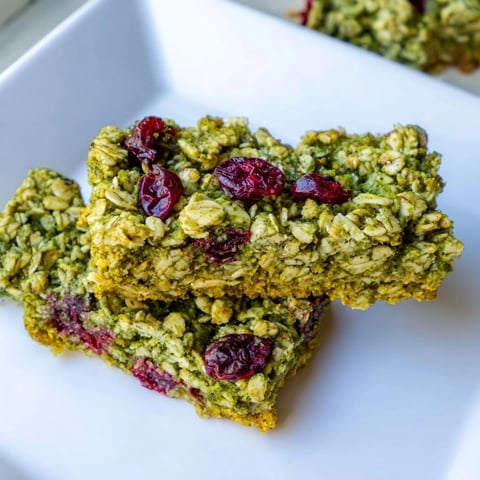 Golden, oat-topped Matcha Cranberry Oat Crumble Breakfast Bars, perfect for a grab-and-go morning treat.