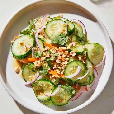 Fresh Thai-Style Peanut Cucumber Salad, vibrant with cilantro and peanuts, ready to eat.