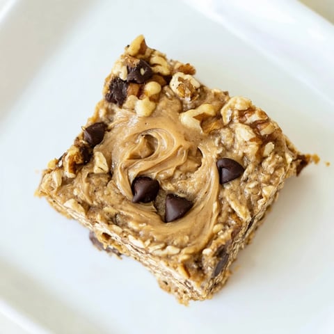 A close-up of Peanut Butter Banana Oat Bars, showing a chewy, delicious texture.
