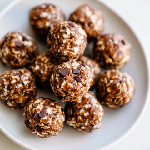 Golden-brown Almond-Chia Energy Bites stacked on a tray, ready for a healthy snack or quick breakfast.