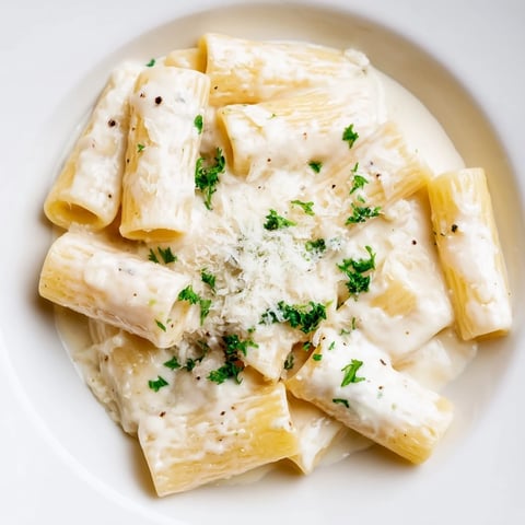 Creamy Milk Pasta One-Pot steaming in a deep skillet, topped with fresh parsley and grated Parmesan for a cozy weeknight dinner.