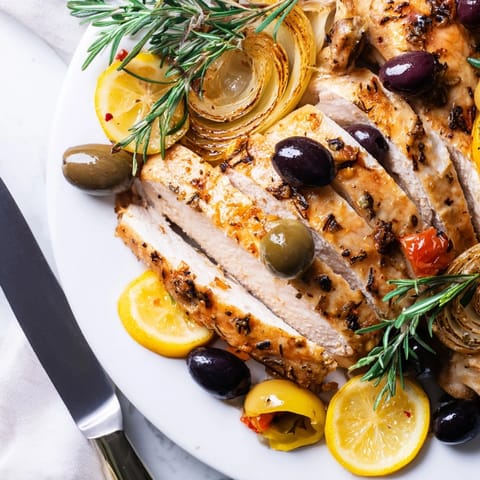 Fragrant Rosemary Garlic Roasted Chicken with Olives: golden skin, savory herbs in every bite.