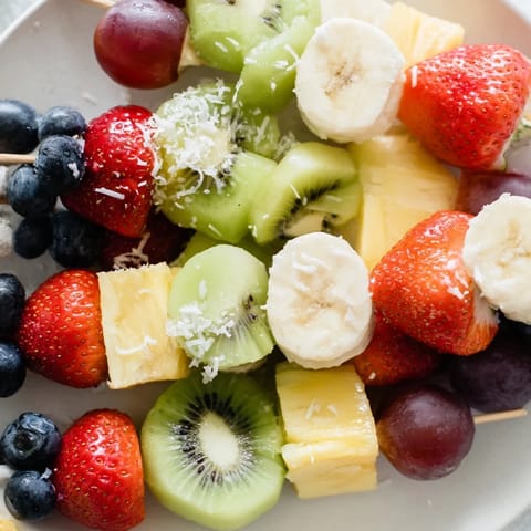 Delectable close-up of colorful easy festive fruit kabobs, perfect for a summer picnic or dessert.