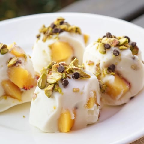 These bright, refreshing Frozen Peach Yogurt Bites are perfectly chilled, sweet, and bursting with peach flavor.