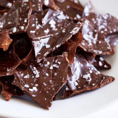 Golden, crispy potato chips blanketed in rich chocolate for this easy chocolate potato chip bark recipe.