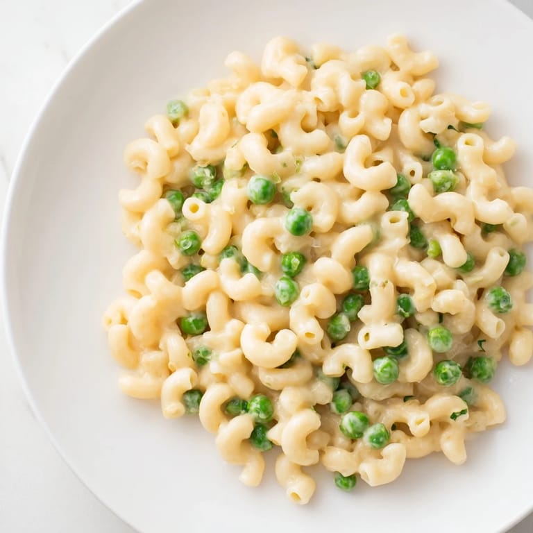 Cheesy Macaroni & Peas, vibrant green peas nestled in perfectly cooked pasta.