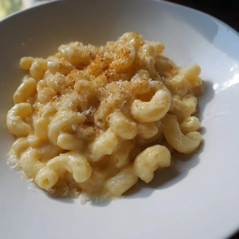 Golden and bubbly mug mac & cheese, a comforting single-serving recipe in a mug.