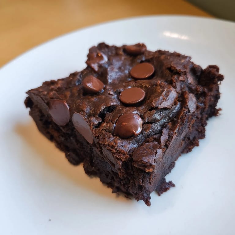 A close-up of decadent black bean brownies, a healthier, homemade chocolate treat option.