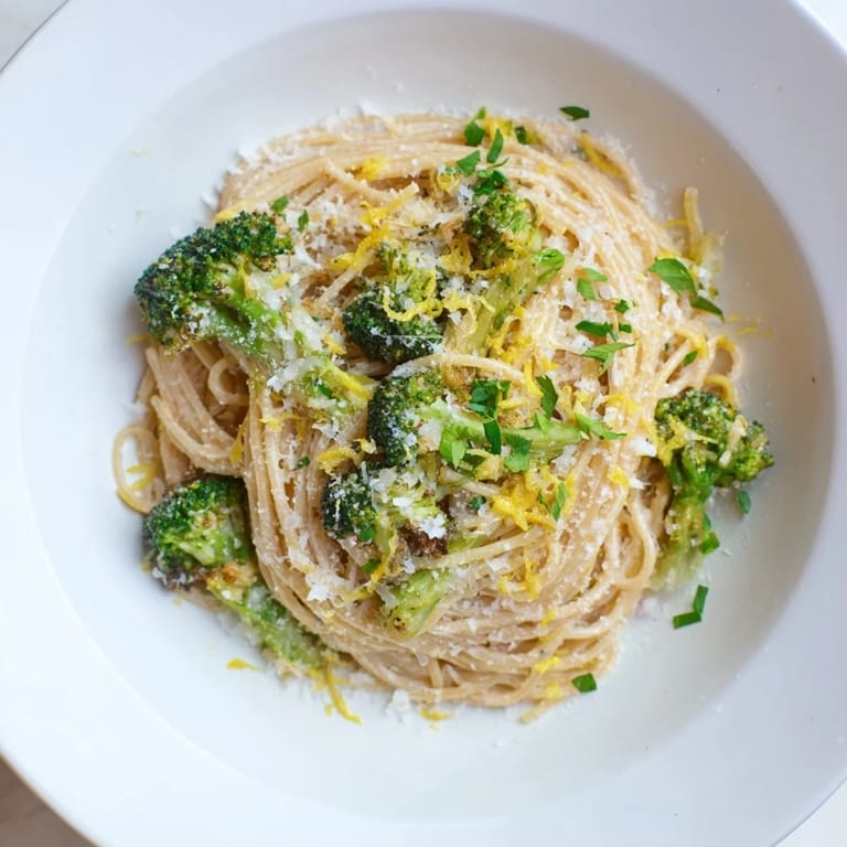 A steaming bowl of Roasted Garlic Lemon Broccoli Angel Hair Pasta, perfect for a cozy weeknight meal.