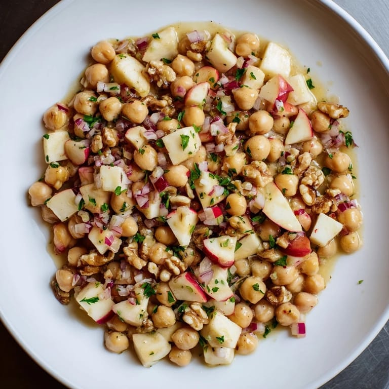 Tossed Fall Harvest Apple and Chickpea Salad, with walnuts and a delicious honey-mustard dressing.