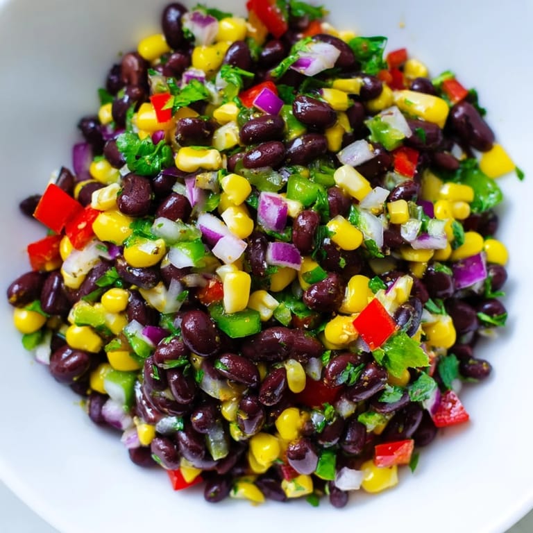 Close-up of a refreshing Cowboy Caviar Salad: black beans and corn bursting with flavor.