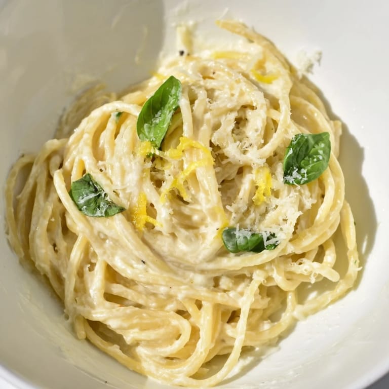 Steaming bowls of Lemon Ricotta Pasta topped with chopped parsley and extra Parmesan, ready for a weeknight Italian dinner.