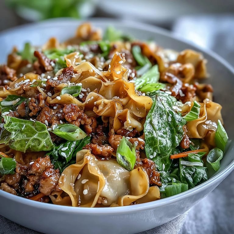 Enjoy a close-up of this Potsticker Noodle Bowls dinner, featuring sautéed vegetables and herbs in a rich, aromatic Asian-style broth.