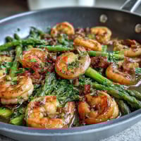 Vibrant one-pan lemon garlic shrimp and asparagus with fresh parsley and lemon zest, perfect for a healthy, quick dinner.