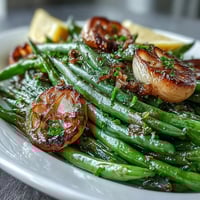 Roasted Garlic Green Beans with caramelized garlic and bright lemon zest, a savory Easter side dish.  
